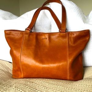 Vintage Roots leather zippered tote bag.